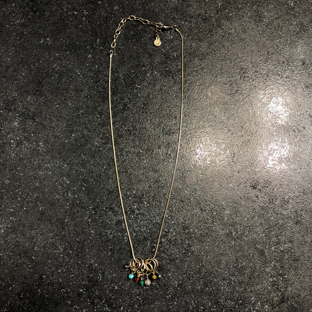Gold necklace with beads on hoops
